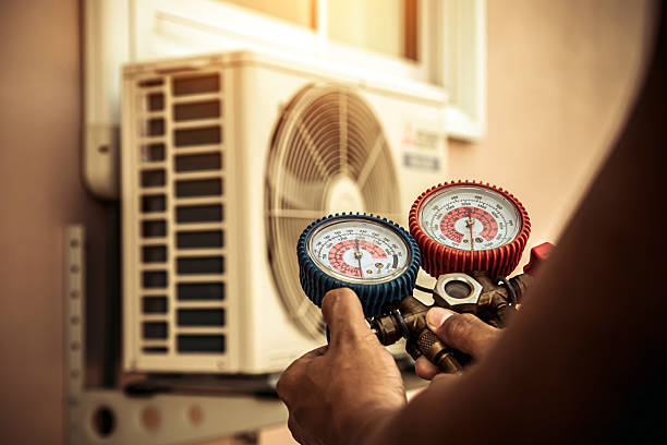 Professional Heat Pump Repair technician working in Plainville, KS
